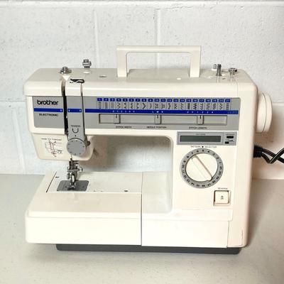LOT 187: Brother Sewing Machine and Oreck Cord Free TX850 Iron
