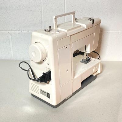 LOT 187: Brother Sewing Machine and Oreck Cord Free TX850 Iron