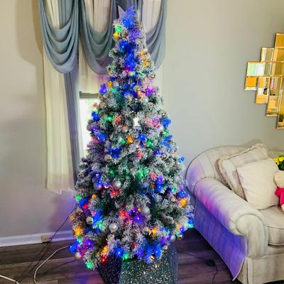 LOT 193: Flocked and Pre-lit Christmas Tree with White and Colored Lights