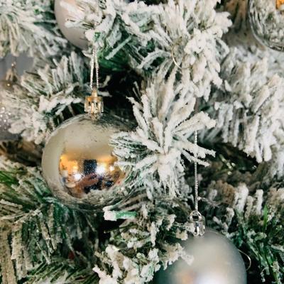LOT 193: Flocked and Pre-lit Christmas Tree with White and Colored Lights