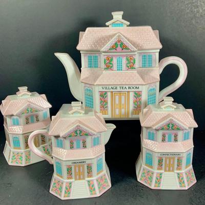 LOT 210: Lenox The Love Village Tea Pot, with Lid, Creamer, and Two(2) Sugar Bowls
