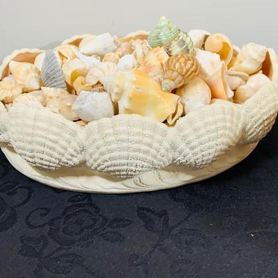 LOT 222: Beach Inspired Decor Featuring Sea Shell Bowls Loaded with Seashells, Towels and Wall Art.