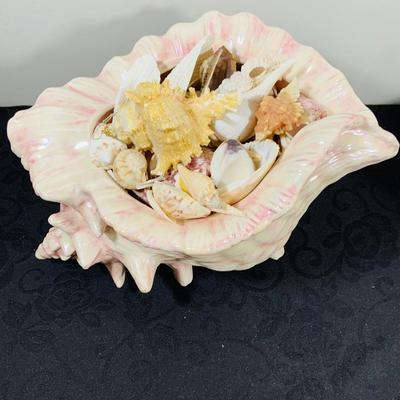 LOT 222: Beach Inspired Decor Featuring Sea Shell Bowls Loaded with Seashells, Towels and Wall Art.