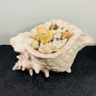 LOT 222: Beach Inspired Decor Featuring Sea Shell Bowls Loaded with Seashells, Towels and Wall Art.