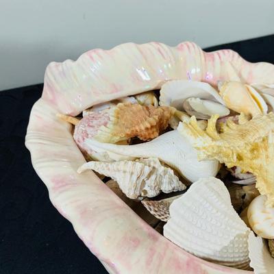 LOT 222: Beach Inspired Decor Featuring Sea Shell Bowls Loaded with Seashells, Towels and Wall Art.
