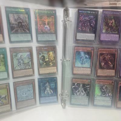Binder with about 150 yu gi oh cards