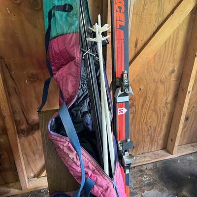 Sale Photo Thumbnail #180: Ski boots and and two pairs of skis 
Excel & kastle and poles