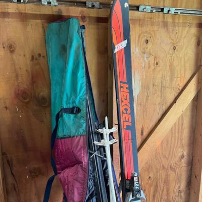 Sale Photo Thumbnail #183: Ski boots and and two pairs of skis 
Excel & kastle and poles