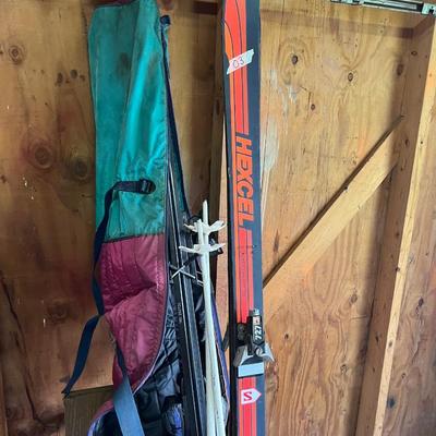Sale Photo Thumbnail #178: Ski boots and and two pairs of skis 
Excel & kastle and poles
