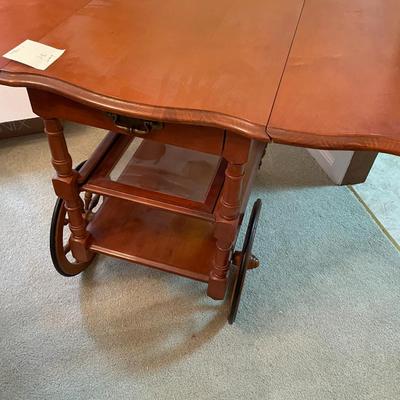 Sale Photo Thumbnail #124: Drop Leaf Early American Wood Serving Cart with 1 drawer and a removal glass serving tray 
