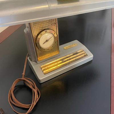 Sale Photo Thumbnail #170: Swivel top Antique Desk light manufactured by Telechrom  Light works, clock does not.  It may need some electrical work  