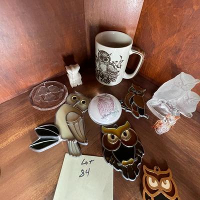 Sale Photo Thumbnail #234: A collection of items included hanging leaded glass owls, figurines, etx