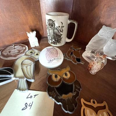 Sale Photo Thumbnail #235: A collection of items included hanging leaded glass owls, figurines, etx