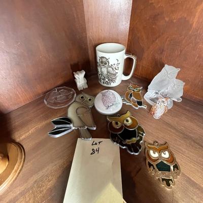 Sale Photo Thumbnail #233: A collection of items included hanging leaded glass owls, figurines, etx