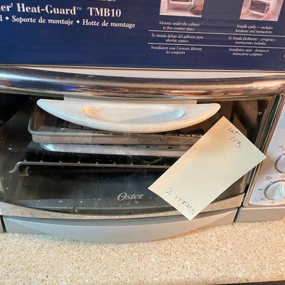 Sale Photo Thumbnail #328: Oster small toasting oven and B&D heat guard mount