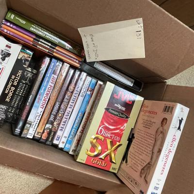 Sale Photo Thumbnail #387: A box DVDs and VHS tapes