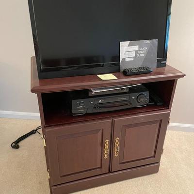 Sale Photo Thumbnail #609: Vizio TV with external antenna, tv stand, zenith DTV tuner and VHS player
