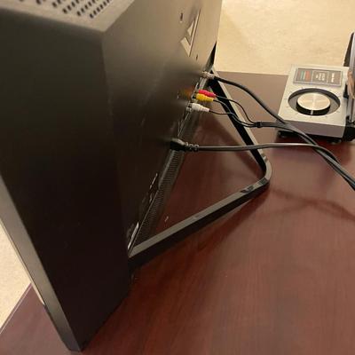 Sale Photo Thumbnail #613: Vizio TV with external antenna, tv stand, zenith DTV tuner and VHS player