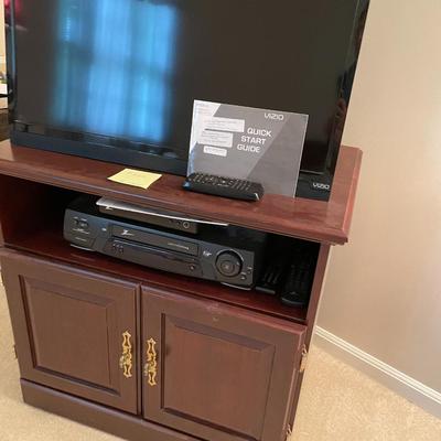 Sale Photo Thumbnail #610: Vizio TV with external antenna, tv stand, zenith DTV tuner and VHS player