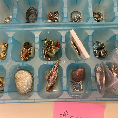 Sale Photo Thumbnail #655: 2 Ice Trays filled with costume jewelry - pins, earring and pendants