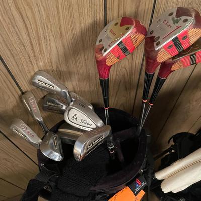 Sale Photo Thumbnail #746: Golf Set #1 includes various brands of golf balls, tees, clubs, sock covers