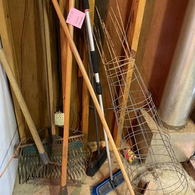 Sale Photo Thumbnail #855: Rake & Broom Lot includes various sized metal rakes, brooms, & tomato cages