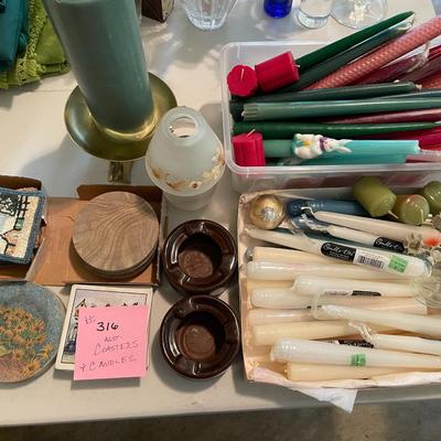 Sale Photo Thumbnail #947: Large assortment of taper and pillar candles along with coaster