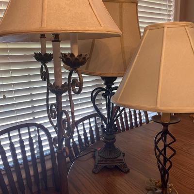 Sale Photo Thumbnail #224: Three lamps one stand up and two table top Iron lamps.

Lamps only