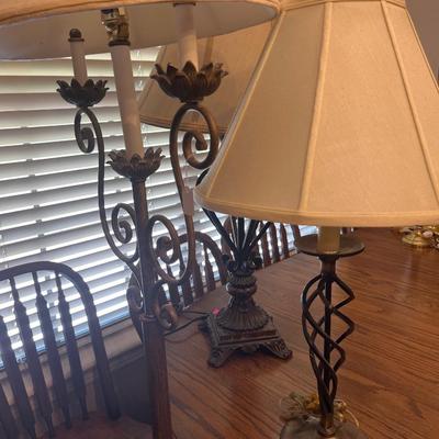 Sale Photo Thumbnail #223: Three lamps one stand up and two table top Iron lamps.

Lamps only