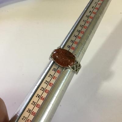 Silver toned fashion ring with stone