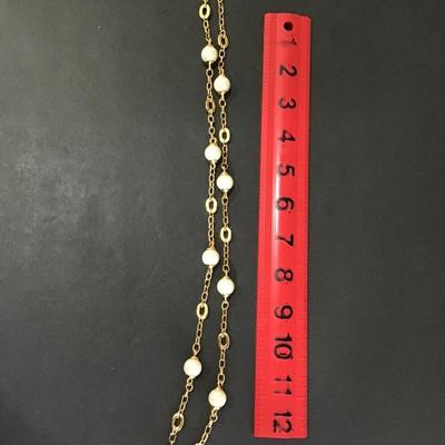 Gold tone necklace with faux pearl beads