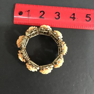 Gold tone, stretch, fashion statement bracelet with roses