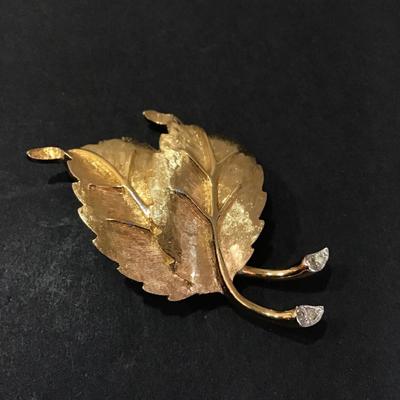Gold tone, leaf pin with rhinestones