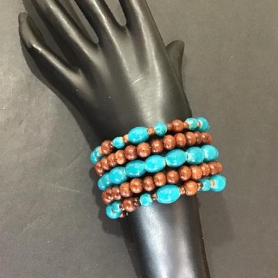 Polished blue glass beads and wood beaded bracelet