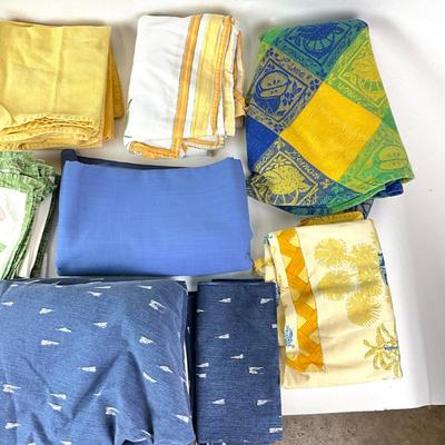 Sale Photo Thumbnail #1314: Comes with two large blue circle table linens
Various blue and yellow lining linens
Smallest: 15" square
Big blue linens are 11" diameter x 64" wide