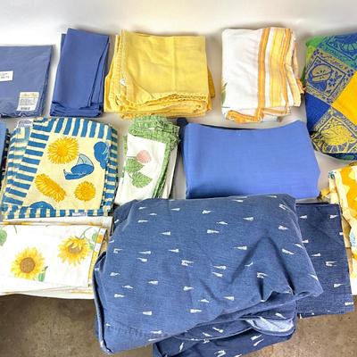 Sale Photo Thumbnail #1315: Comes with two large blue circle table linens
Various blue and yellow lining linens
Smallest: 15" square
Big blue linens are 11" diameter x 64" wide