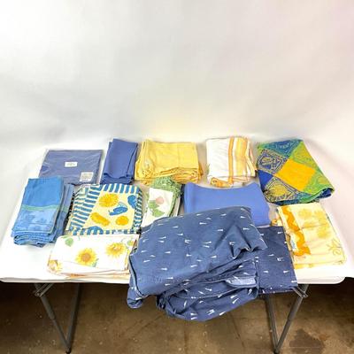Sale Photo Thumbnail #1313: Comes with two large blue circle table linens
Various blue and yellow lining linens
Smallest: 15" square
Big blue linens are 11" diameter x 64" wide
