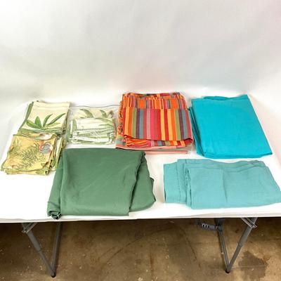 Sale Photo Thumbnail #1317: Total of seven linens
One large green table linen
Large green round table linen measures: 72" diameter
Smallest linen measures: 15" square