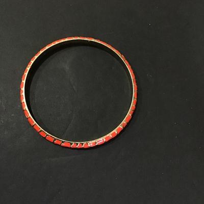 Gold tone, bangle bracelet with Reddish pink enamel
