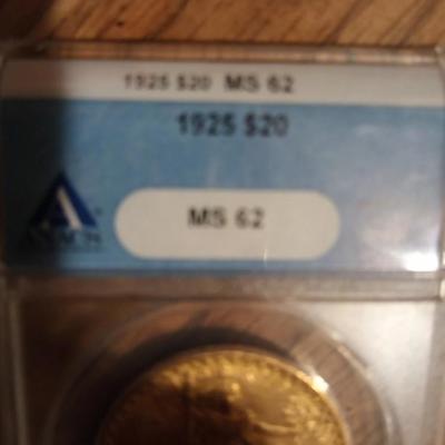 Sale Photo Thumbnail #2: The product is a 1925 $20 Saint Gaudens Gold D,ouble E,agle MS62 co,in, graded by ANACS. This uncirculated c oin is composed of 0.9 fineness gold and was struck as a business strike in Philadelphia. A valuable piece of US coinage from the pre-1933 era, th