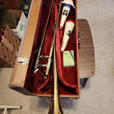 Sale Photo Thumbnail #197: This auction lot is for a Frank Holton & Company Trumpet.  This wonderfully unique musical instrument has seen a few blue notes. The previous owner was in a touring Jazz Band.  It has been stored for at least 40 years.  This trumpet was manufactured by th