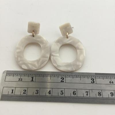 Unmarked white fashion earrings