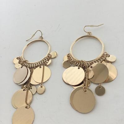 Gold tone dangle statement earrings