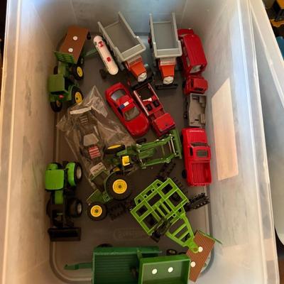 Sale Photo Thumbnail #50: Tractor & Trucks as shown in both plastic tubs