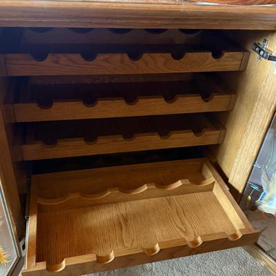 Sale Photo Thumbnail #221: 25 bottle center wine - 6’l x 22’w x 32”t Oak Wine Cab