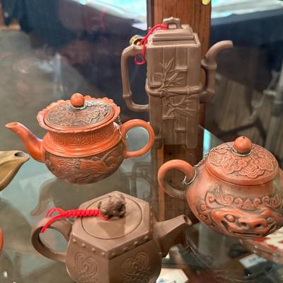 Sale Photo Thumbnail #855: A collection of 11 different ceramic Tea Pots as shown