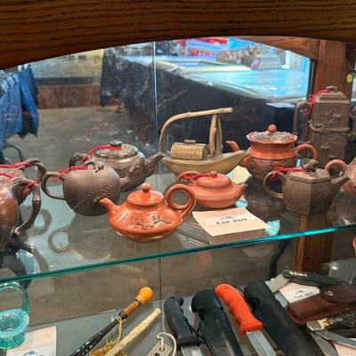 Sale Photo Thumbnail #852: A collection of 11 different ceramic Tea Pots as shown