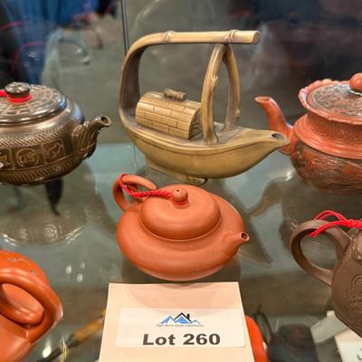 Sale Photo Thumbnail #854: A collection of 11 different ceramic Tea Pots as shown