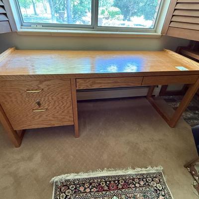 Sale Photo Thumbnail #1101: Oak Wood 66”l x 29”t x 24”d 4 drawer desk 1 locks