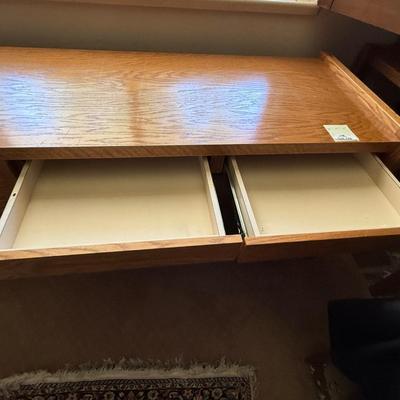 Sale Photo Thumbnail #1103: Oak Wood 66”l x 29”t x 24”d 4 drawer desk 1 locks